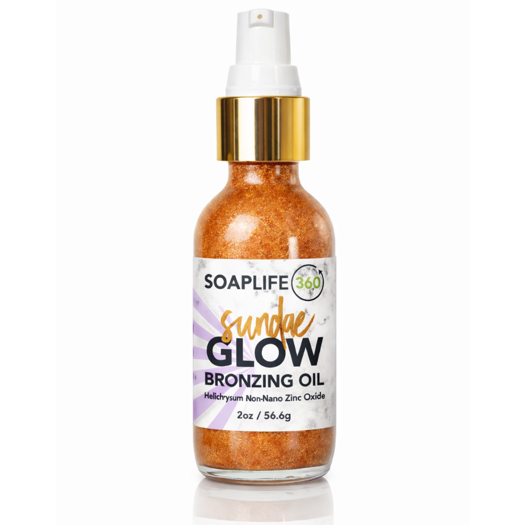 Bronzing oil bottle with gold cap and white label on a white background