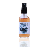 A spray bottle of Aloe Mist Hydrating Toner from Soap & Water, with a clear liquid visible through the bottle.