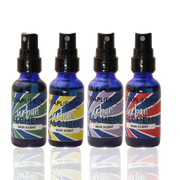 Four blue spray bottles labeled Urban Alchemy Skin Scent, with different color schemes and designs on each bottle.