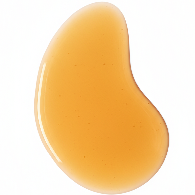 large swatch of golden jojoba oil on a white background